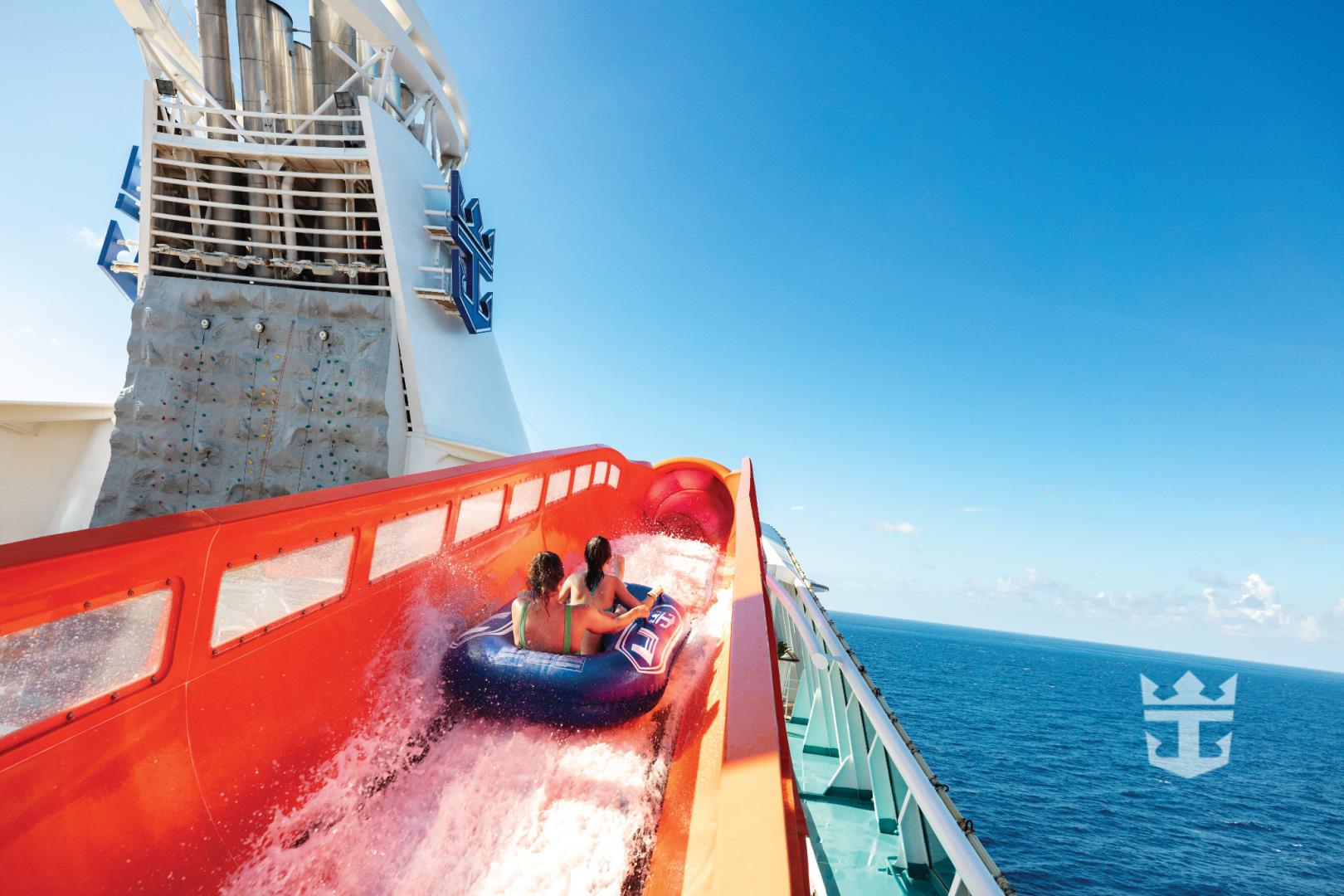 View of two girls riding an inflatable tube on Blaster water slide